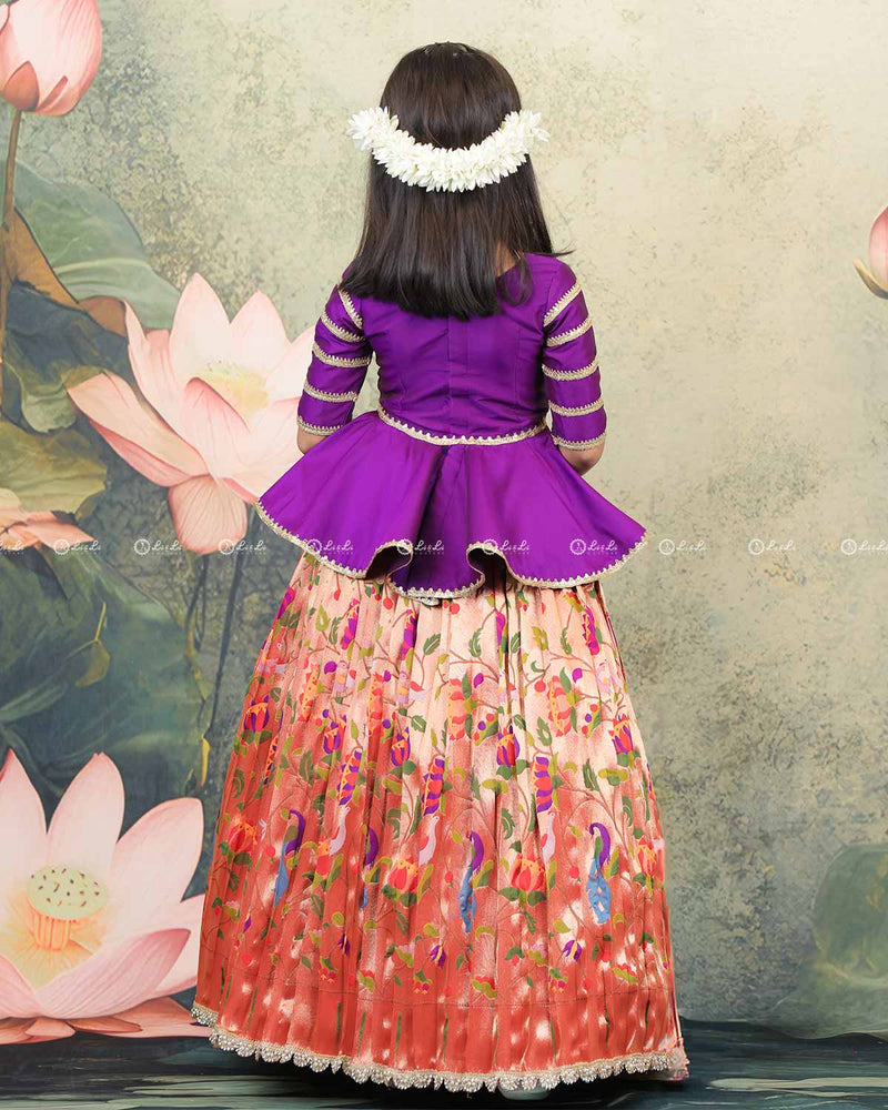 Purple Peplum Top Paired With A Printed Skirt