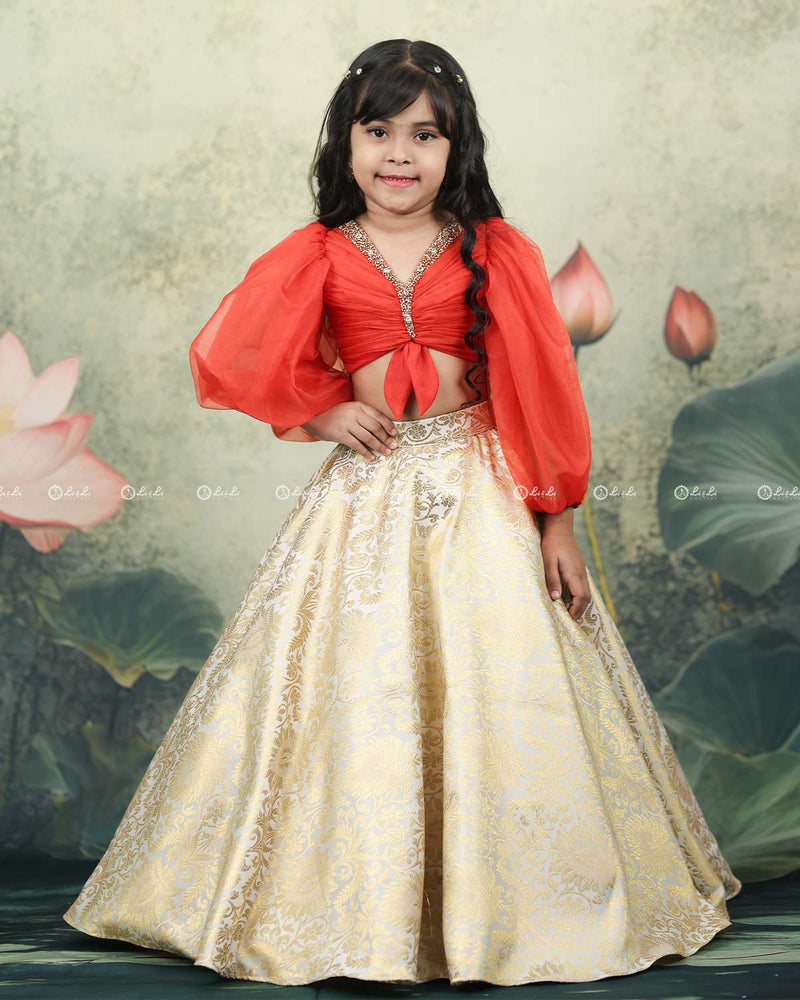 Deep orange organza balloon sleeve crop top with ivory brocade umbrella skirt for girls