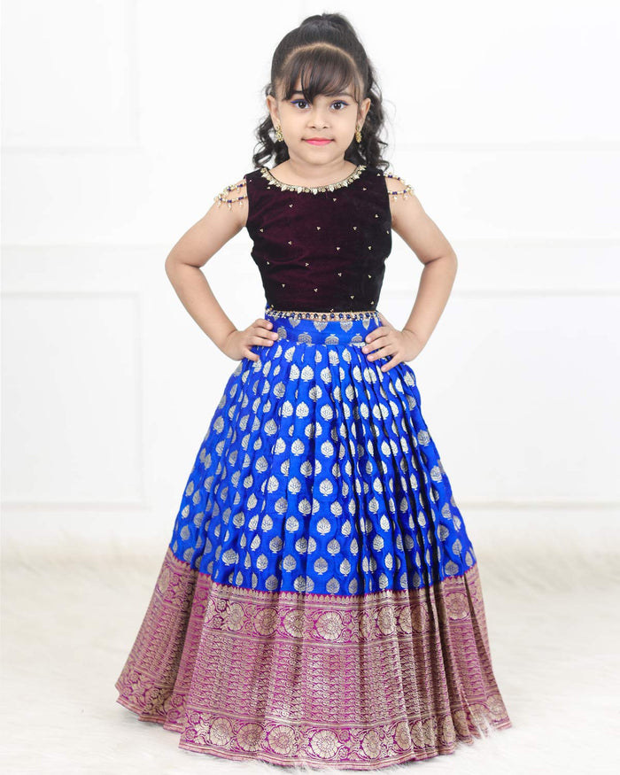 Girls royal blue and purple brocade and velvet sleeveless top with pearl work and knife pleated skirt