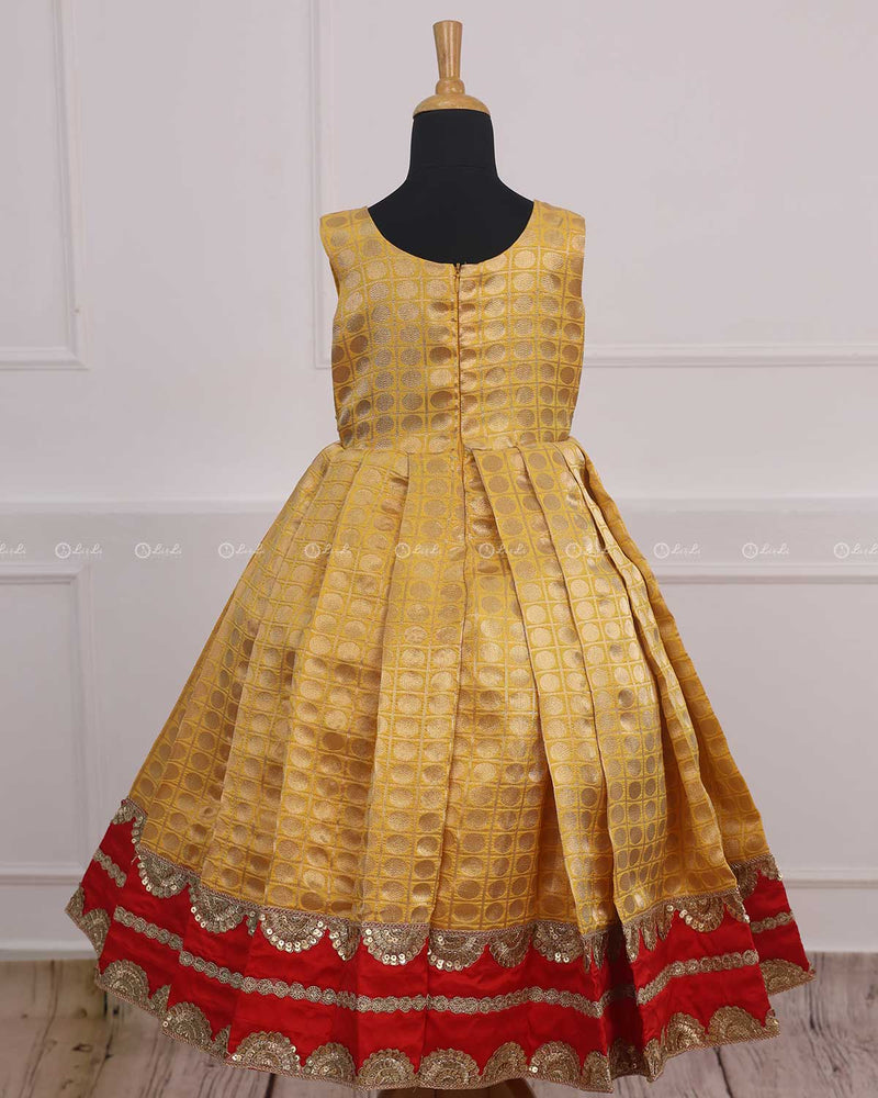 Yellow brocade gown with red peplum hand crafted yoke part