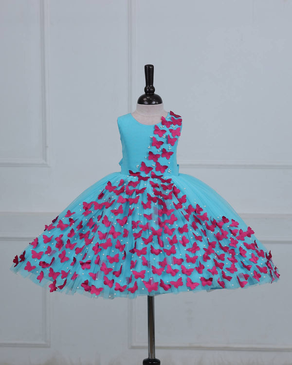 Aqua Marine Blue Partywear Frock with Spreaded Rani Pink Butterflies