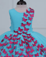 Aqua Marine Blue Partywear Frock with Spreaded Rani Pink Butterflies