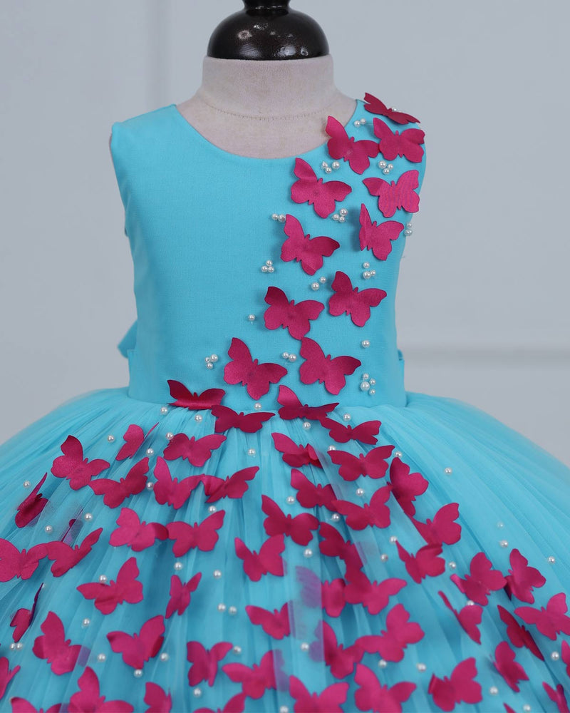Aqua Marine Blue Partywear Frock with Spreaded Rani Pink Butterflies