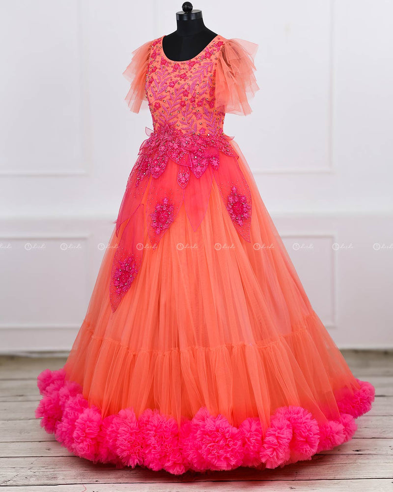 Coral and fuchsia pink designer gown with applique flowers and bead work detailing