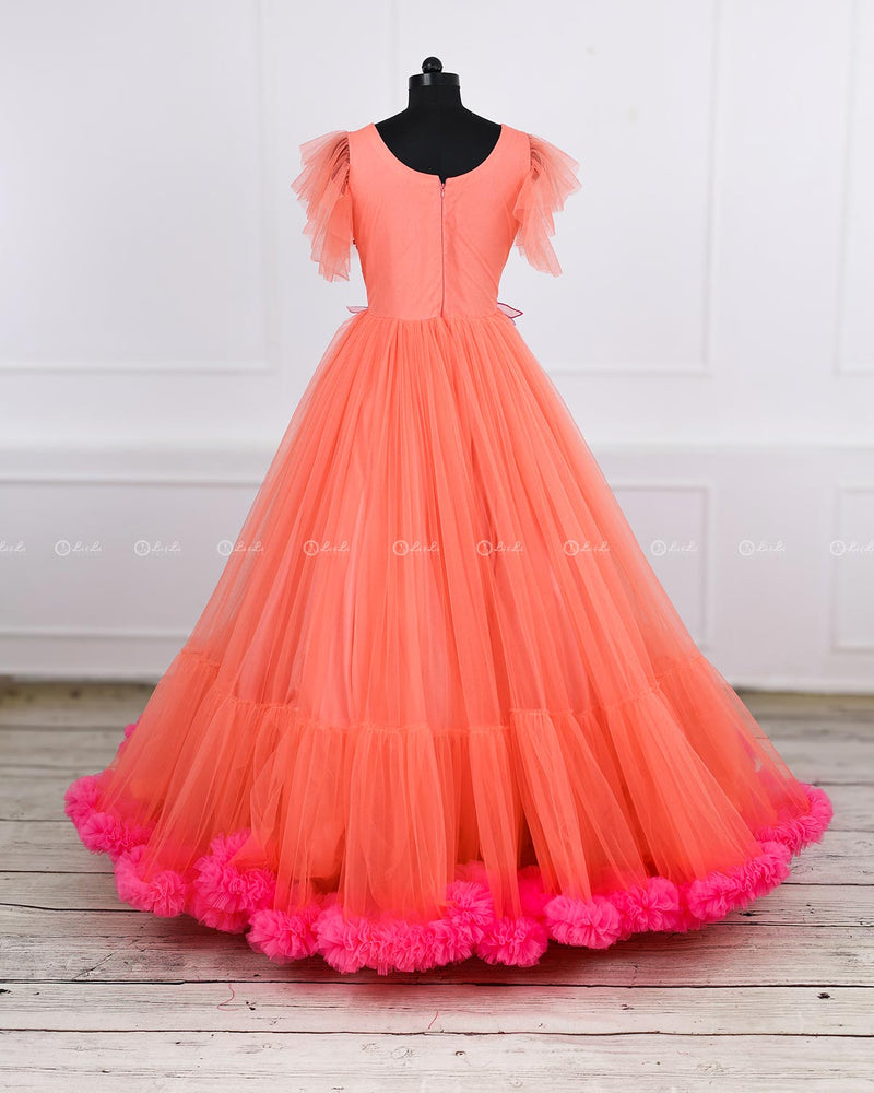 Coral and fuchsia pink designer gown with applique flowers and bead work detailing