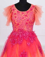 Coral and fuchsia pink designer gown with applique flowers and bead work detailing