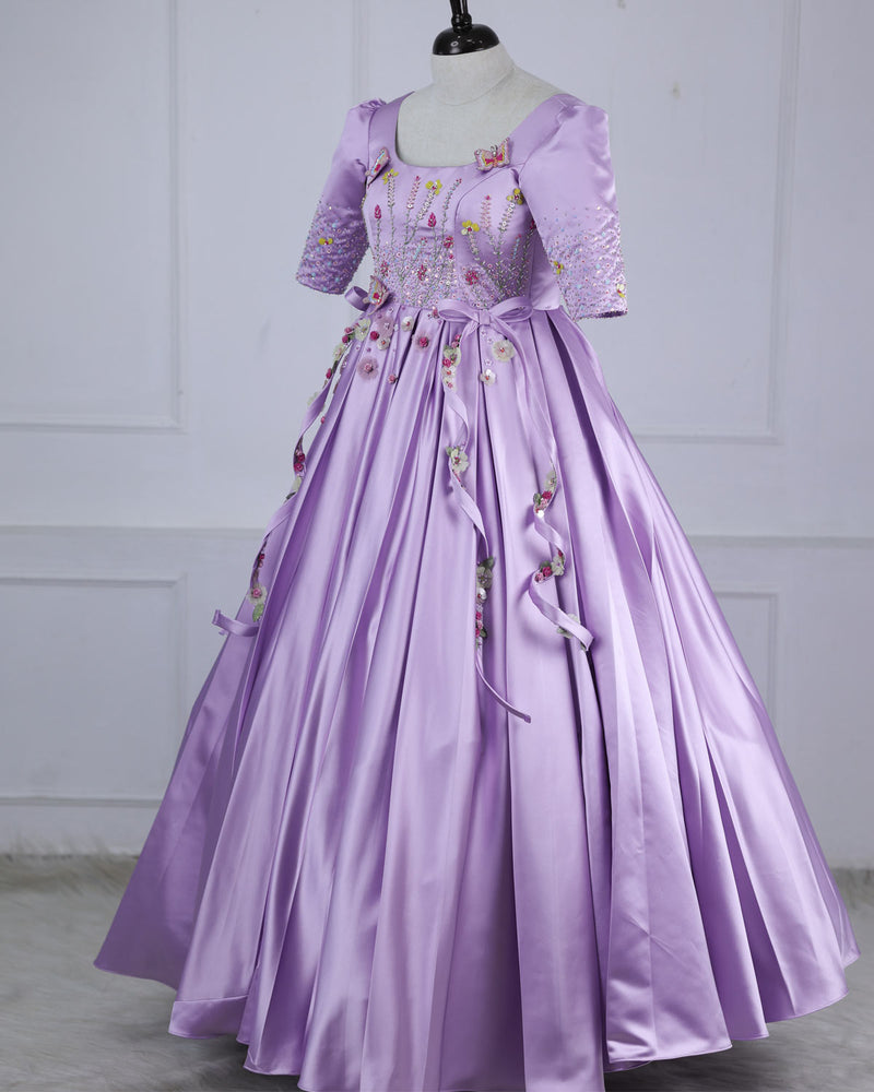 Butterfly and Floral Theme Lavender Gown with Attached Bows and Applique Works.
