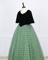Dark Forest Green velvet sweetheart gown with flowy sleeves and a mint heart-mesh flare.