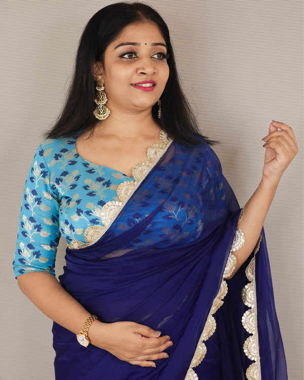 Deep indigo blue organza saree and sky blue brocade blouse piece