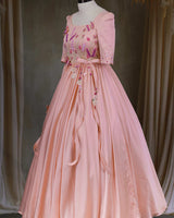Butterfly and Floral Theme Peach Gown with Attached Bows and Applique Works.