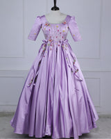 Butterfly and Floral Theme Lavender Gown with Attached Bows and Applique Works.