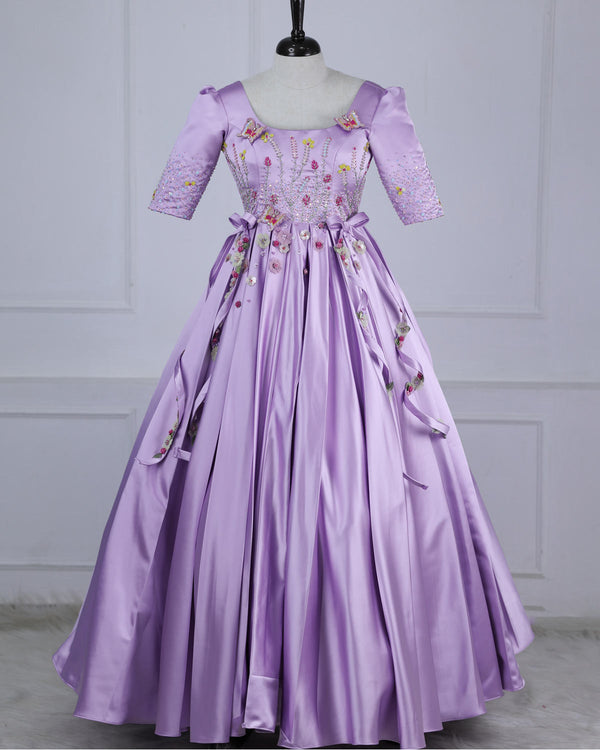 Butterfly and Floral Theme Lavender Gown with Attached Bows and Applique Works.