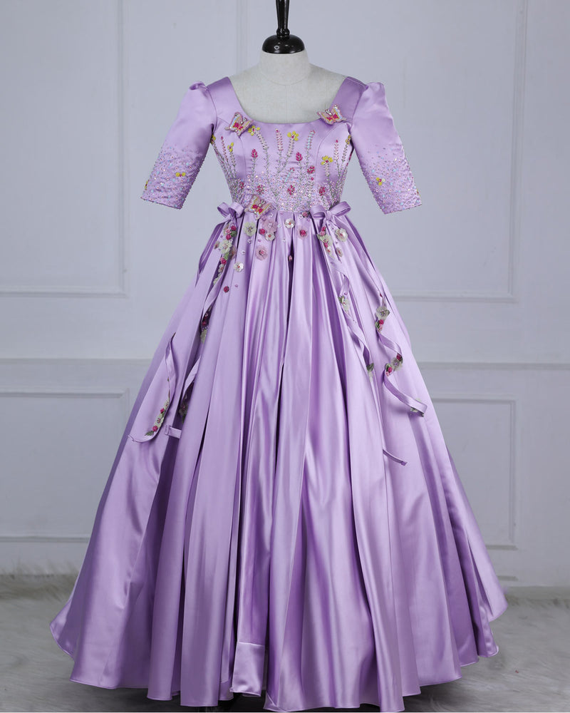 Butterfly and Floral Theme Lavender Gown with Attached Bows and Applique Works.