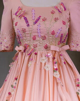 Butterfly and Floral Theme Peach Gown with Attached Bows and Applique Works.