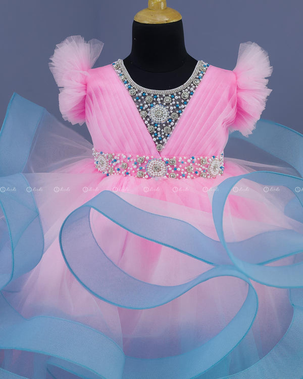 Baby Pink and Sky Blue Twirled Gown with Rich White Bead Work.