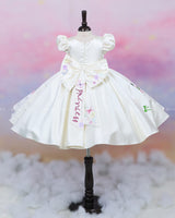 Enchanting hand-painted frock featuring princesses and a fairytale castle—perfect for a magical occasion.