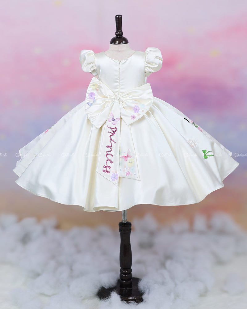 Enchanting hand-painted frock featuring princesses and a fairytale castle—perfect for a magical occasion.