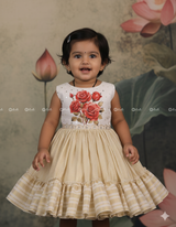 Ivory Frock With Printed Red Roses On The Yoke, Pearl Embellishments And A Pleated Striped Flare