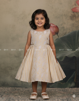 Ivory Frock With Brocade Bodice, Embellished Waist Highlights And Pleated Striped Flare