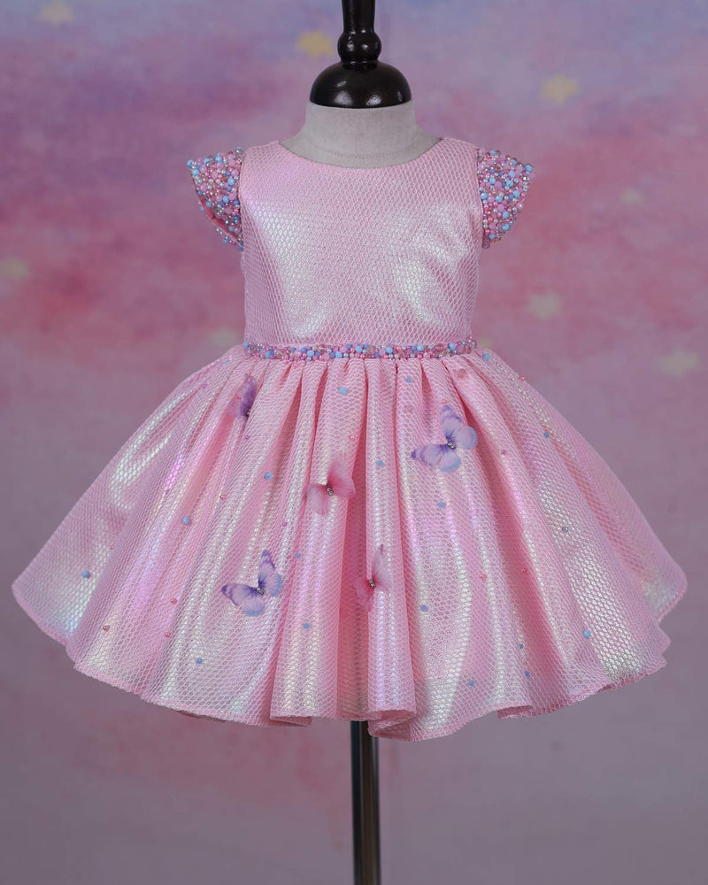 Elegant Baby Pink Frock Highlighted with beads and stones with Handcrafted Multicolour butterflies.