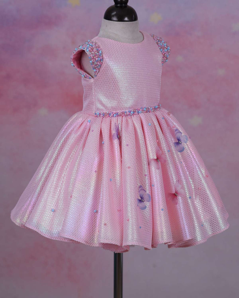 Elegant Baby Pink Frock Highlighted with beads and stones with Handcrafted Multicolour butterflies.