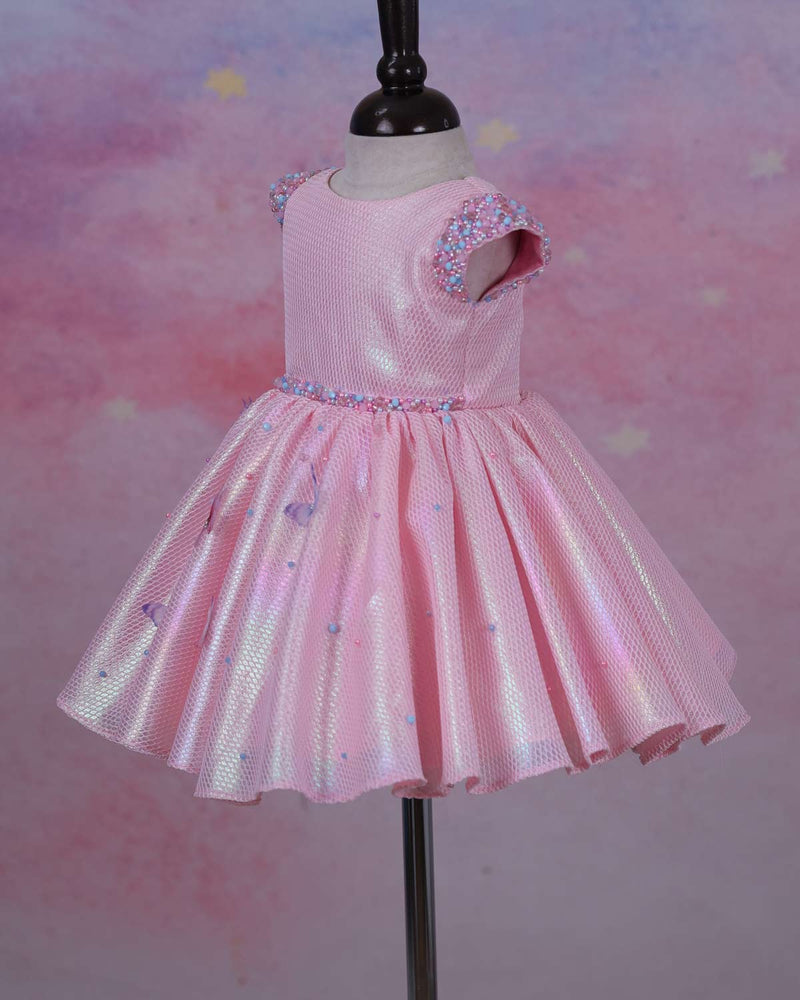 Elegant Baby Pink Frock Highlighted with beads and stones with Handcrafted Multicolour butterflies.