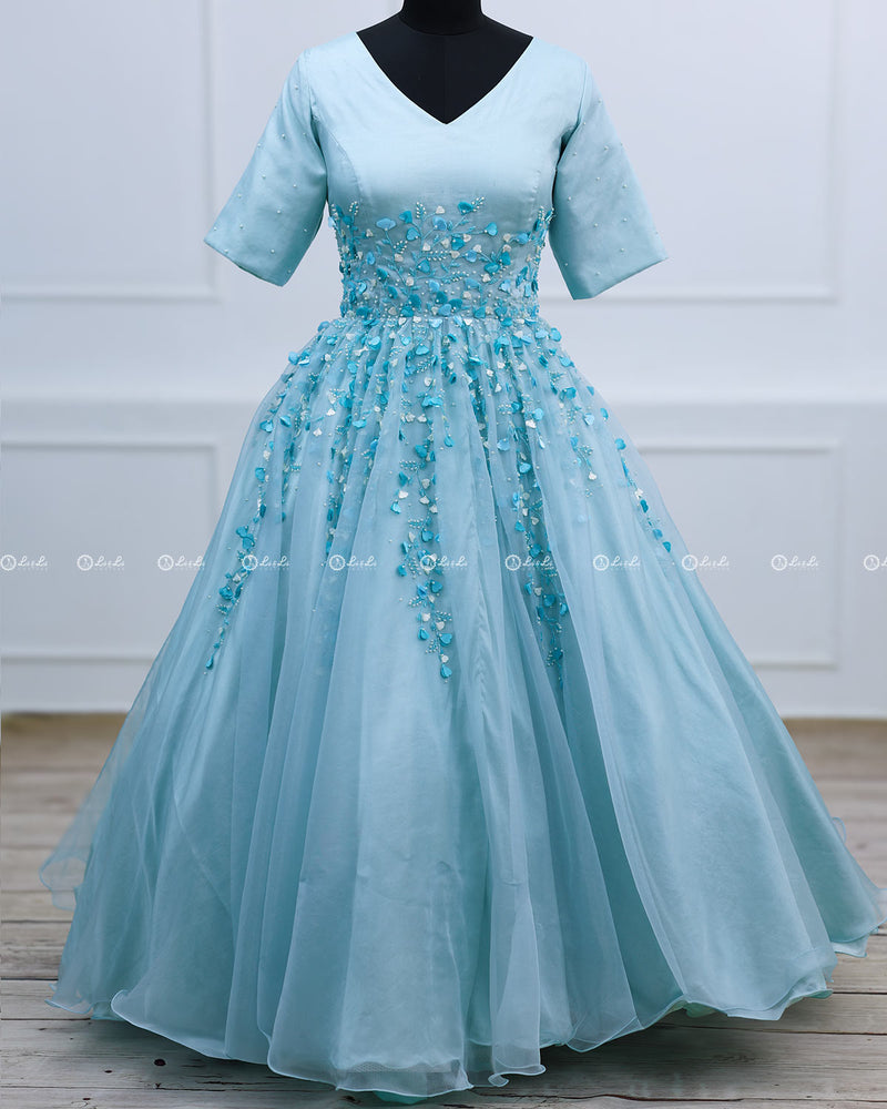 Light Sky Blue Elegant Gown Highlighted With Handcrafted Flowers.