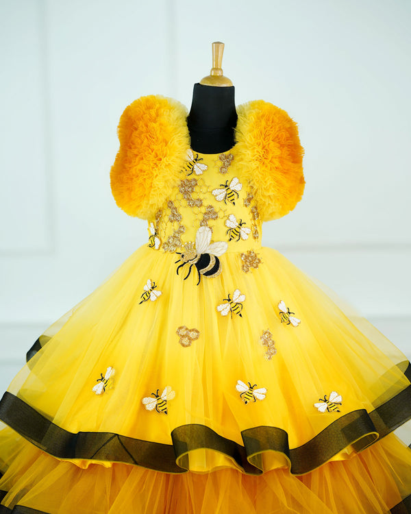 Yellow Color Gradient Netted Ball Frill Sleeve Full gown with handcrafted honeybee theme bead embellishments and a black ruffled border