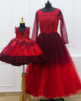 Red and maroon ombre shaded designer gown with applique flowers and bead work