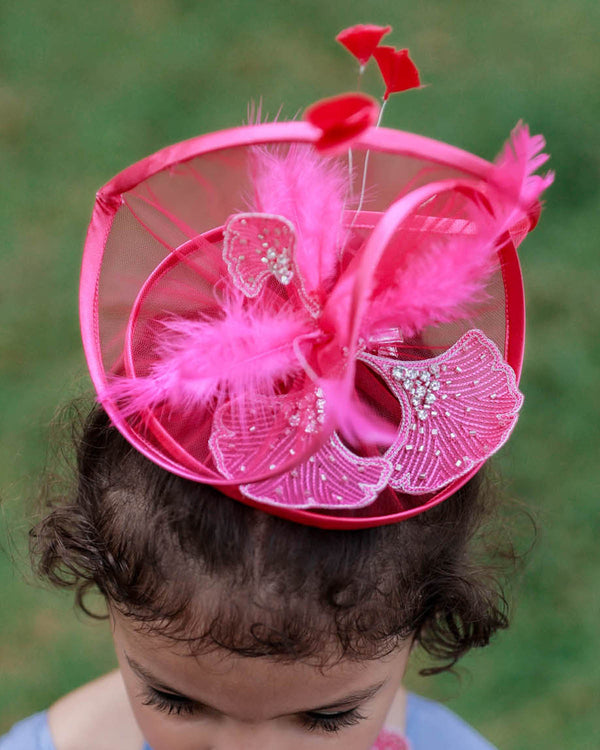 Pink color twirled hair clip with feathers and hand-worked embellishments