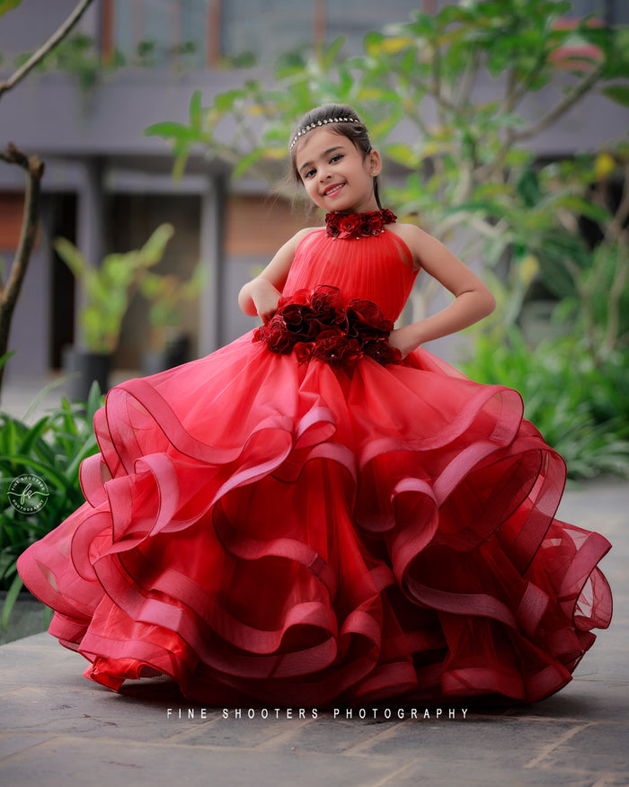 Red and maroon ombre twirl gown with pleated halter neck and handcrafted flowers for girls